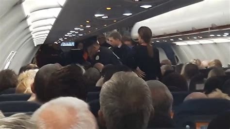 Moment Police Escorting Disruptive Easyjet Passenger Off Flight