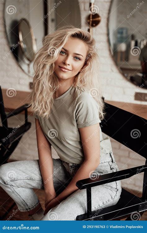 Elegant Blonde Posing On A Chair In A Makeup Artist X27 S Room Stock