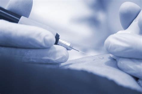 Premium Photo Cropped Hand Of Doctor Examining Patient In Hospital