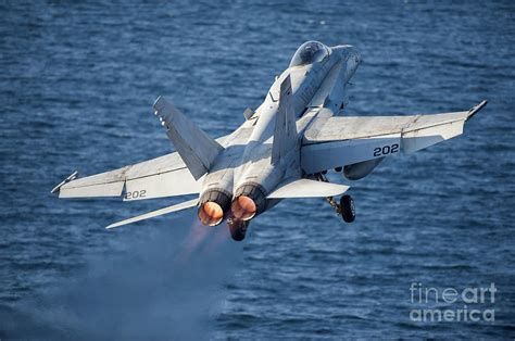 An Fa 18c Hornet Launches Photograph By Stocktrek Images Fine Art America