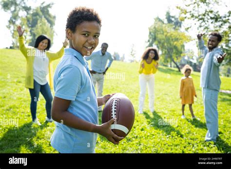 Beautiful happy african american family bonding at the park - Black ...