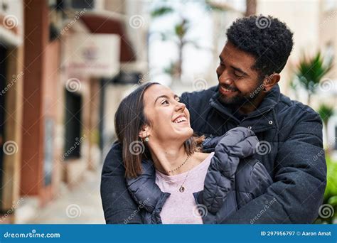 Man And Woman Couple Smiling Confident Hugging Each Other At Street