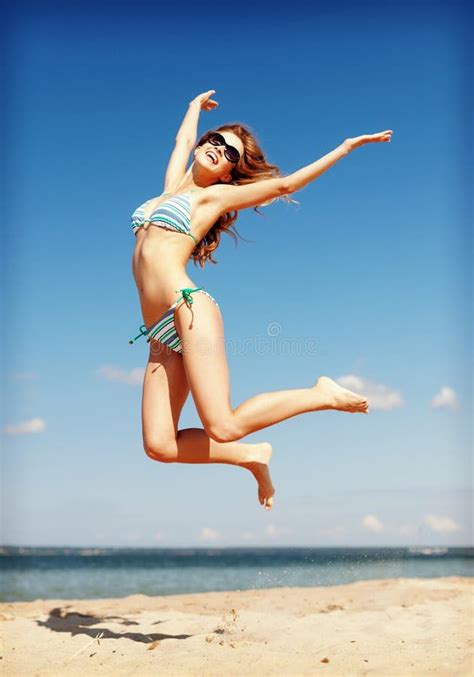 Woman In Bikini Jumping On The Beach Stock Image Image Of Legs Girl