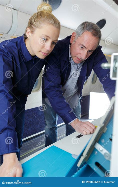 Aero Engineer And Apprentice Working On Aircraft Stock Photo Image Of