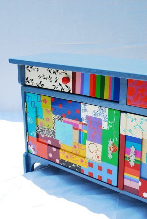 A Multicolored Dresser Is Sitting On A Blue Surface