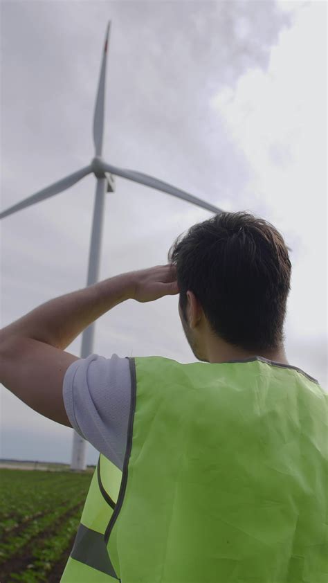 An engineer inspects a wind turbine in the field. 41261775 Stock Video ...