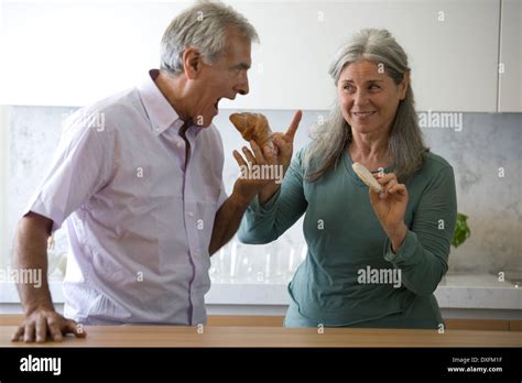 Mature Couple Eating Snack Food Stock Photo Alamy