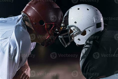 Two American Football Players Face To Face In Silhouette Shadow On