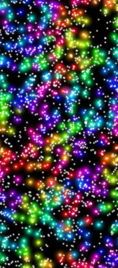 an image of many colorful lights in the night sky with stars and ...