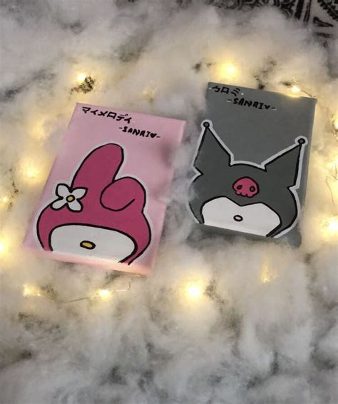 Two Notebooks With Cartoon Characters On Them Sitting On Some Fluffy