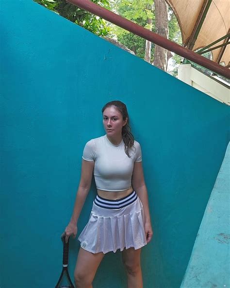 Series Of Photos Of Wulan Guritno Showing Her Flat Stomach At The Gym Wearing A Bikini Top