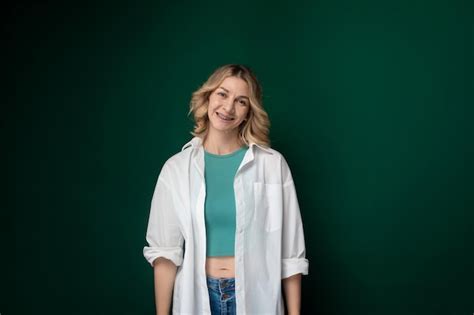 Premium Photo Woman Standing In Front Of Green Wall