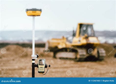 Surveyor Equipment GPS System Outdoors at Highway Construction Site. Surveyor Engineering with ...