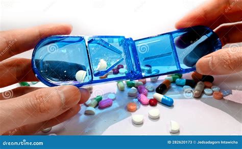 Precision and Efficiency: Cutting and Dividing Pills with Care Stock ...