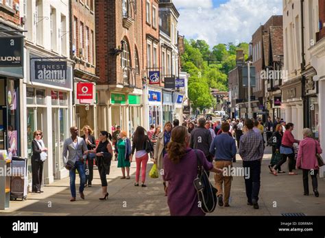 Busy Shopping Street Uk With Shops In Winchester Hampshire Stock