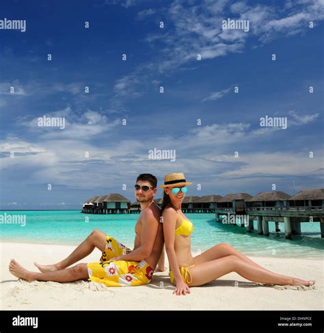 Couple on a beach at Maldives Stock Photo - Alamy