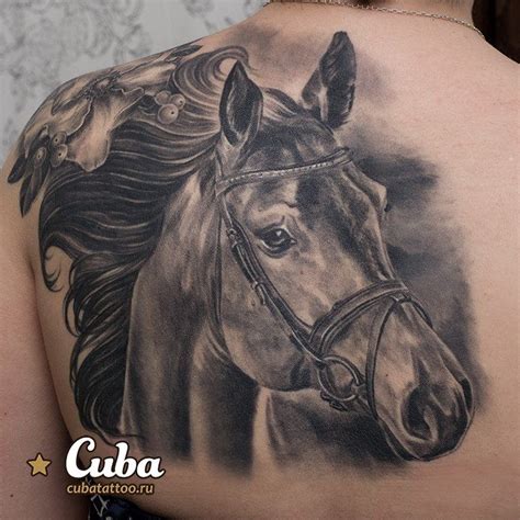 Impressive very detailed looking black and white horse tattoo on back ...