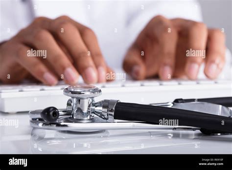doctor typing  computer keyboard stock photo alamy
