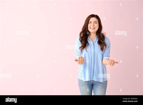 Beautiful Young Woman Showing Come Here Gesture On Color Background