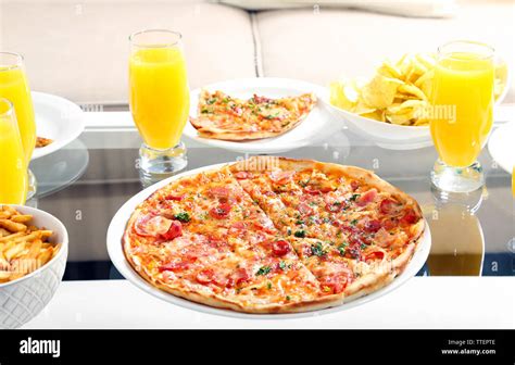 Table at home with pizza and drinks for friends Stock Photo - Alamy