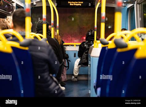 Double decker bus interior with passengers Stock Photo - Alamy