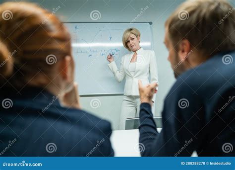 Caucasian Woman Blonde Leads A Presentation For Colleagues Stock Photo Image Of Leads