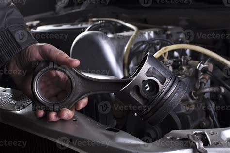 Car engine maintenance. Engine piston system repair. Hands with a ...