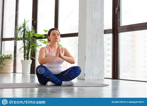 Middle Aged Woman Meditating At Home Healthy Lifestyle Concept Stock