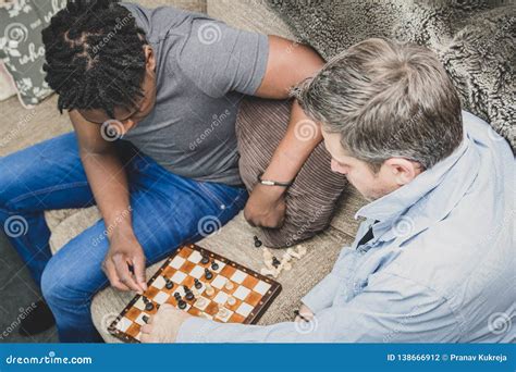 A Gay Couple Enjoying Time Indoors At Home Playing Chess Stock Photo Image Of Facial Date