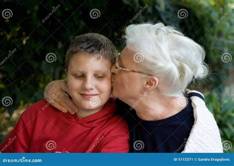 Granny Grandson Both Blonde Kisses Cuddling And Kissing Royalty Free Stock Photo