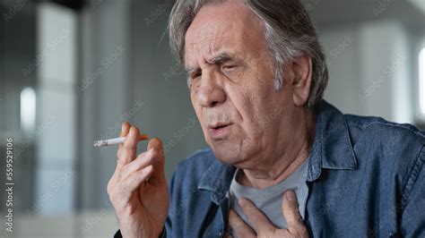 Old Man Smoking A Cigarette Stock Photo Adobe Stock