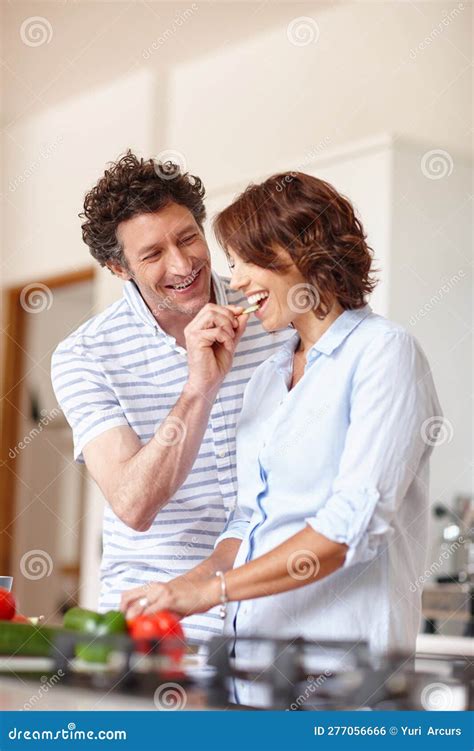 Taste How Amazing This Is A Happy Mature Couple Cooking A Healthy Meal Together At Home Stock