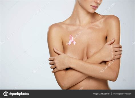 Naked Woman With Breast Cancer Awareness Ribbon On Chest Stock Photo By Puhhha