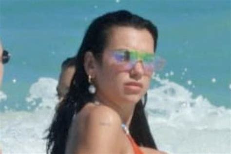 Dua Lipa Takes Summers Most Daring Trend On The Water In A String Bikini Cutout Dress