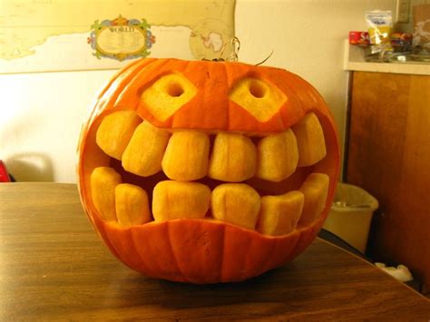 A Pumpkin With Teeth Carved Into It