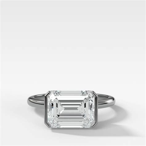 East West Half Bezel Solitaire Engagement Ring With Emerald Cut Diamon