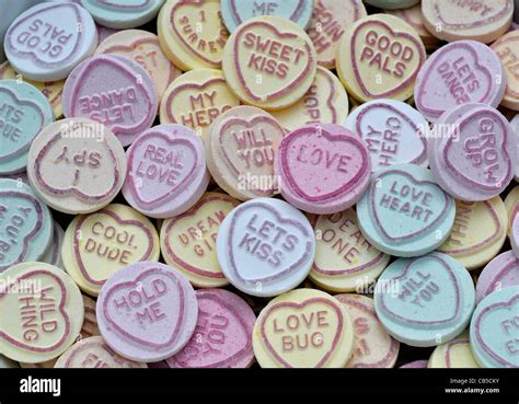 Pile Of Colourful Love Heart Candy Sweets Showing A Variety Of Romantic