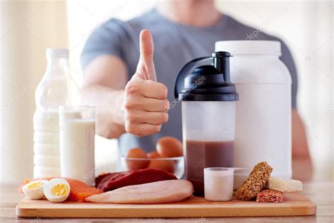 Man with protein food showing thumbs up — Stock Photo © Syda ...