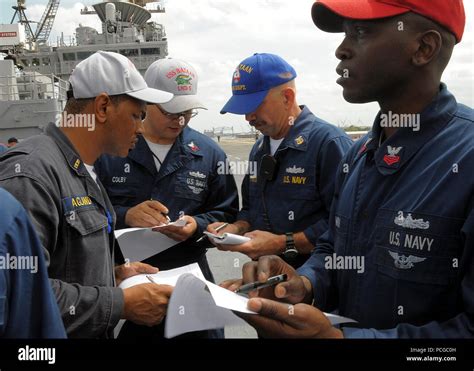 Sailors Aboard The Multipurpose Amphibious Assault Ship Uss Bataan