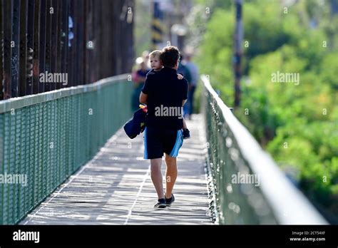 A Man And Boy Walk Across The Bridge Hi Res Stock Photography And