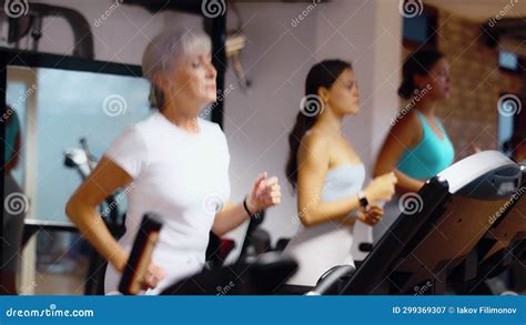 Mature Sportswoman Training At Elliptical Machine In Modern Gym Stock Video Video Of Weight