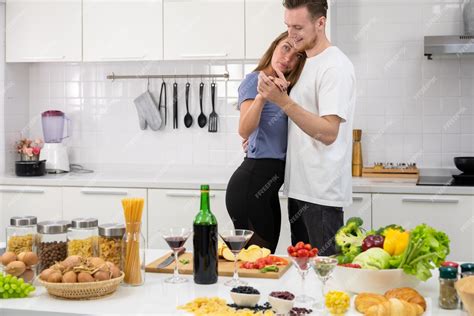 Premium Photo Happy Couple Spending Time Together Cooking Romantic Dinner And Dancing In