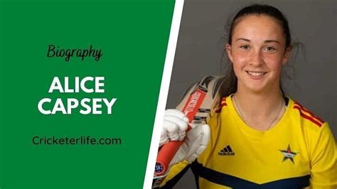 A Girl In Yellow Jersey Holding A Cricket Ball And Bat With The Words