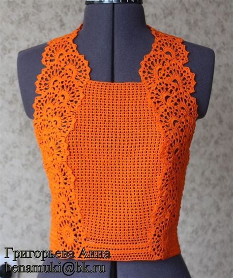 An Orange Crochet Top On A Mannequin