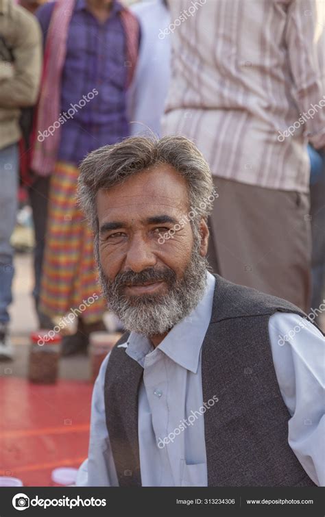 Portrait Of Male Hawker Selling Their Goods At Meena Bazaar Mar Stock