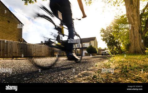 A bike going quickly past the viewer from the left. The bike is ...