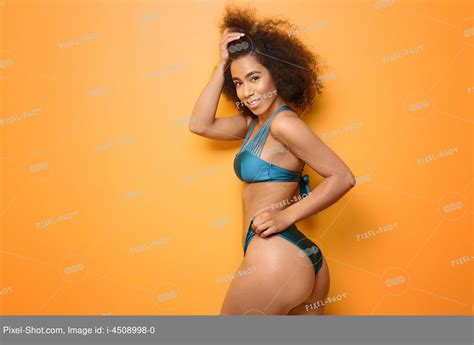 Beautiful African American Woman In Bikini On Color Background Stock Photography Agency