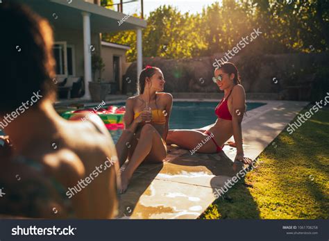 Group Girls Bikini Sitting On Edge Stock Photo Edit Now