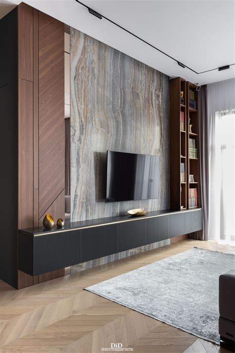 A Living Room With A Large Television On The Wall