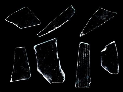 Premium Photo Shards Of Glass Isolated On A Black Background High Quality Photo